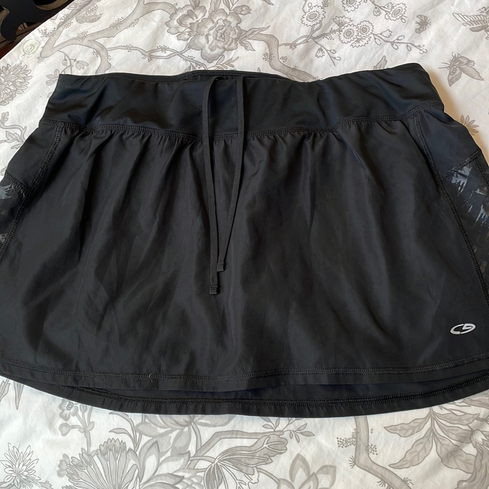 Bundle 3 items and save 20% and save on shipping. Black skort. Good condition.